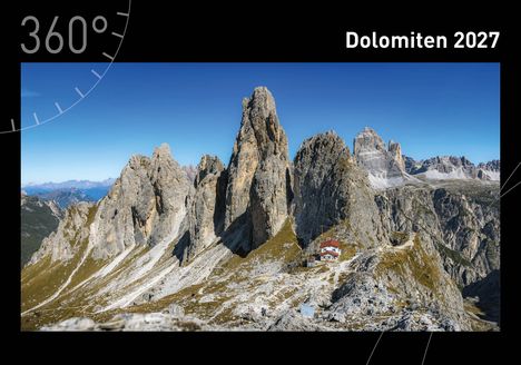 "Dolomiten 2027." Steile, helle Bergformationen unter strahlend blauem Himmel, ein kleines rotes Haus am Hang.