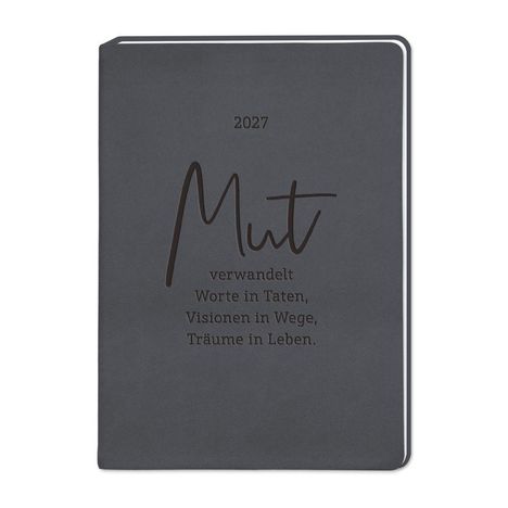 2027. „Mut verwandelt Worte in Taten, Visionen in Wege, Träume in Leben.“ Auf grauem Notizbuch.