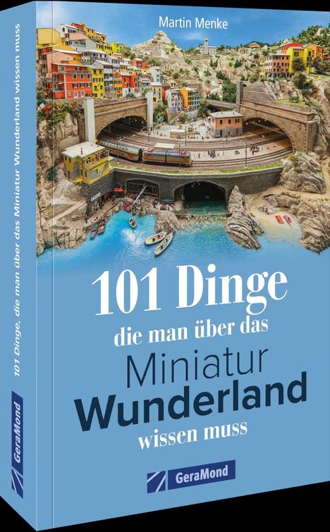 "101 Dinge die man über das Miniatur Wunderland wissen muss." Bunte Modellstadt mit Zugstrecke und Hafen.