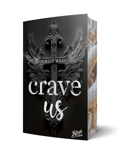 "Emily West, crave us, Black Edition." Ein dekoratives Kreuz mit Flügeln auf schwarzem Hintergrund.