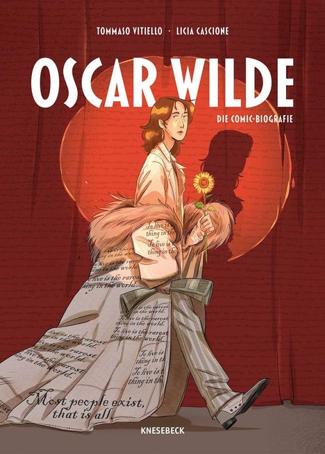 "Oscar Wilde: Die Comic-Biografie. Eine Figur im Mantel hält eine Sonnenblume, Worte auf Kleidung als Dekoration."