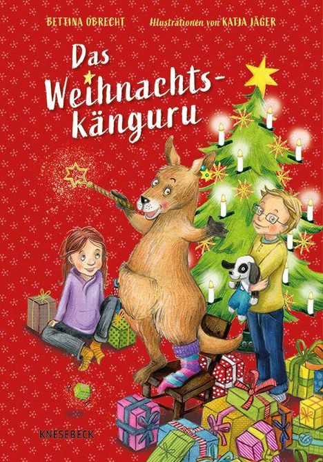 "Das Weihnachts-Känguru" in einer Illustration: Ein fröhliches Känguru mit zwei Kindern vor einem festlichen Weihnachtsbaum.