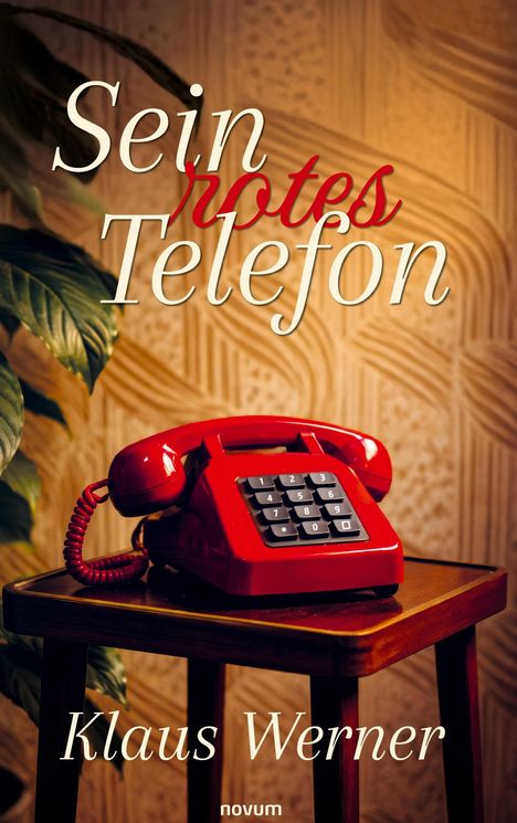 "Sein rotes Telefon" und "Klaus Werner". Ein rotes Telefon auf einem Tisch, im Hintergrund Tapete und Pflanze.