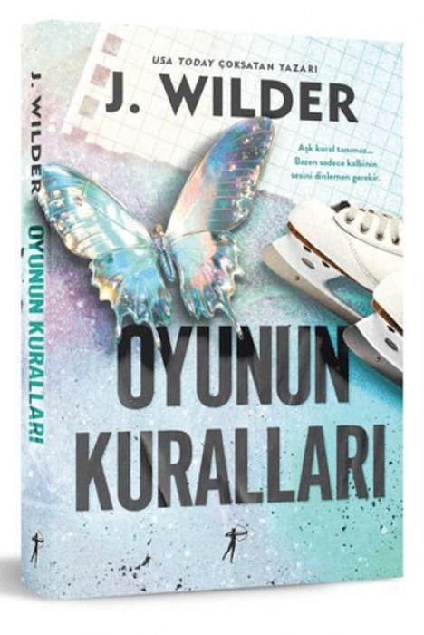 Text: "J. Wilder, OYUNUN KURALLARI". Glänzender Schmetterling und Eiskunstlaufschuhe auf buntem Hintergrund. Buchcover.