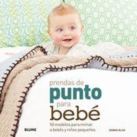 Text: "prendas de punto para bebé". Ein Baby lächelt und liegt unter einer gestrickten Decke auf einem Bett.