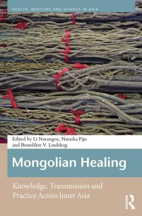 "Mongolian Healing: Knowledge, Transmission and Practice Across Inner Asia." Ein Stapel Äste mit roten Bändern überzogen.