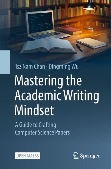"Mastering the Academic Writing Mindset" steht vor einem Schreibtisch mit Laptop, Buch, Notizblock und Lampe.