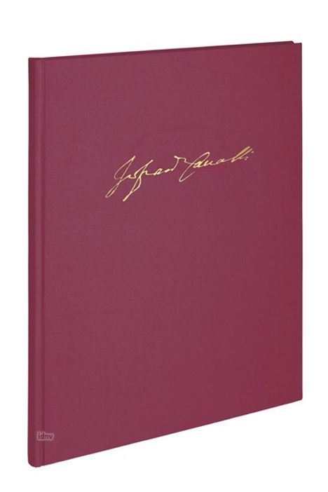 Eine Signatur in goldener Schrift auf einem roten Buchdeckel.