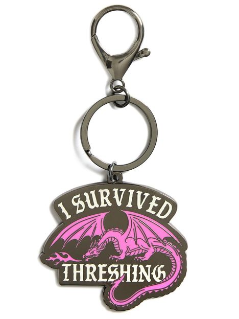Ein Schlüsselanhänger mit der Aufschrift „I SURVIVED THRESHING“ und einer lila Drachenillustration.