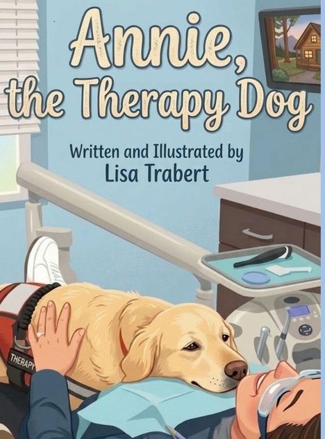 "Annie, the Therapy Dog. Written and Illustrated by Lisa Trabert." Ein Hund liegt auf einem lächelnden Patienten im Zahnarztstuhl.