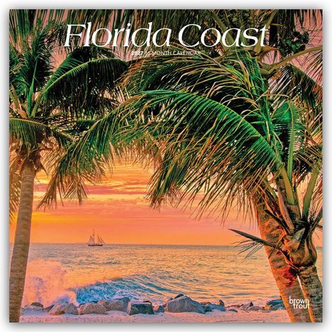 „Florida Coast“, „2024 16 Month Calendar“. Sonnenuntergang am Meer mit Palmen, segelndem Schiff und Wellen an Felsen.