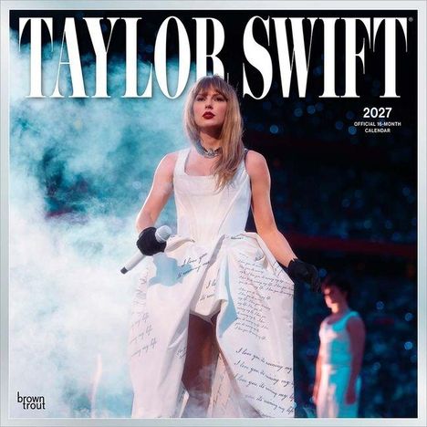 „TAYLOR SWIFT“, „2027, OFFICIAL 16-MONTH CALENDAR“. Eine Frau in einem weißen Kleid auf einer Bühne inmitten von Nebel.