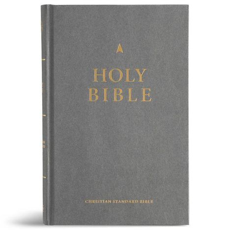 Text: "HOLY BIBLE" und "CHRISTIAN STANDARD BIBLE" auf grauem Hardcover in goldener Schrift.