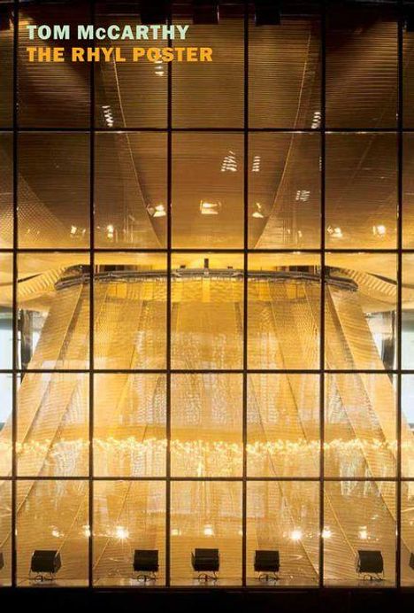 Oben links stehen die Worte "Tom McCarthy The Rhyl Poster" in gelb und weiß. Großes Fenster zeigt hell erleuchtetes Gebäudeinnere.