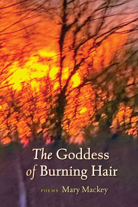 Text: "The Goddess of Burning Hair. Poems Mary Mackey." Hintergrund: Verschwommene Bäume vor einem feurigen, orangenen Himmel.