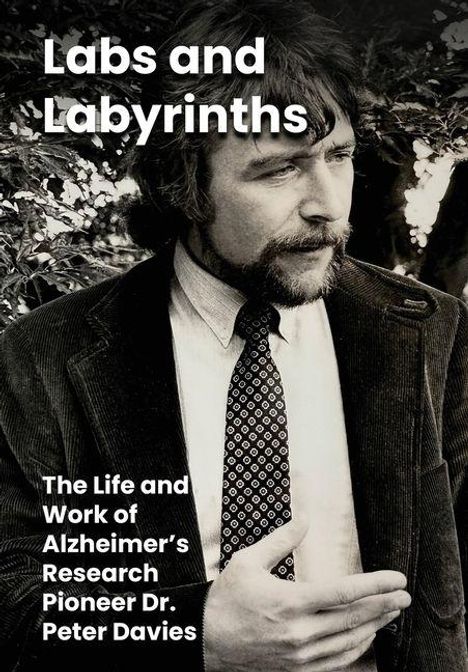 "Labs and Labyrinths. The Life and Work of Alzheimer’s Research Pioneer Dr. Peter Davies." Ein Mann in Anzug und Krawatte.