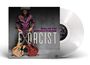 SELWYN BIRCHWOOD EXORCIST. Eine Person in lilafarbener Kleidung hält zwei Gitarren. Links eine transparente Vinyl-Schallplatte.