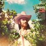 "Duane Betts Isle of Hope" mit Songtiteln, Mann mit Hut zwischen grünen Blättern, blauer Himmel im Hintergrund.