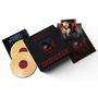 Text: "Andrea Bocelli", "Romanza 30th Anniversary". Zwei Schallplatten und Fotos eines lächelnden Mannes in rotem Pullover.