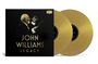 "John Williams Legacy" in goldener Schrift auf schwarzem Hintergrund. Darunter ein Dirigent mit Taktstock, zwei goldene Schallplatten.