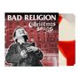„BAD RELIGION Christmas Songs“ steht über einem lachenden Kind mit Schuhen, vor rotem Gebäude.
