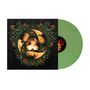 Schwarzes Cover mit Blumenmuster und drei Gesichtern in einem kreisförmigen Design. Grüne Vinylplatte rechts.