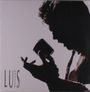 Text: LUIS MIGUEL. Silhouette einer Person mit Mikrofon in dramatischer Pose.