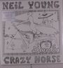 "Neil Young Crazy Horse Dume" in großen Buchstaben, Illustration zeigt einen großen Vogel, ein UFO, Kaktus und Pyramide.