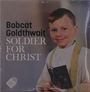 Text: "Bobcat Goldthwait SOLDIER FOR CHRIST". Ein lächelnder Junge in religiöser Kleidung hält ein Buch.