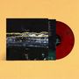 Vorderseite mit "Gilla Band" und "Postmillo". Darunter wellenförmige Linien in Gelb und Blau. Rote Vinyl-Schallplatte.