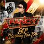 "FANCY 80th Birthday Fan Box". Ein Mann in schwarzem Anzug und Sonnenbrille, umgeben von gold-roten Akzenten und Fotos.