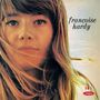 Texte: „françoise hardy.“ Eine junge Frau mit langen Haaren blickt direkt nach vorn.