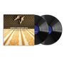 Text: "MAXWELL'S URBAN HANG SUITE". Zwei schwarze Vinyl-Schallplatten und ein Albumcover, darauf hochhackige Schuhe.