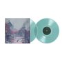 Zwei transparente blaue Schallplatten, daneben ein Cover mit verfallener Landschaft und einem stehenden Vogel im Vordergrund.
