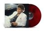 Text: „Michael Jackson Thriller“. Eine Person in weißem Anzug lehnt entspannt. Rote Vinyl-Schallplatte sichtbar.