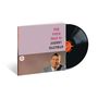 "THE VOICE THAT IS! JOHNNY HARTMAN" auf einem Albumcover, darunter ein lächelnder Mann in Anzug mit einer Schallplatte.