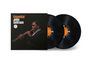 "Essential John Coltrane" steht links oben. Ein Mann spielt ein Saxophon. Zwei schwarze Vinylschallplatten daneben.