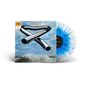 "Tubular Bells, Mike Oldfield" auf einem Albumcover. Abbildung von Röhren vor einem wolkigen Himmel und einer Vinyl-Schallplatte.
