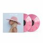 Text: "LADY GAGA / JOANNE". Ein Albumcover mit einer Profilansicht einer Person mit rosa Hut, zwei pinke Vinyl-Schallplatten.