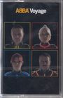 Text: "ABBA Voyage". Vier Porträts in neonbeleuchteten Rahmen, je zwei oben und unten, auf schwarzem Hintergrund.