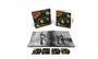 "Rubber Soul" in großer Schrift auf zwei CD-Hüllen. Darunter ein Fotobuch mit einer schwarz-weißen Band auf der Bühne.