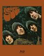 "RUBBER SOUL" steht in geschwungenen Buchstaben. Es zeigt vier Männer mit langen Frisuren vor grünen Blättern.