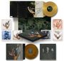 Boxset von "Imagine Dragons" mit Illustrationen von Händen und Vögeln, goldene und braune Schallplatten.
