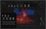 "The Cure" und Info zu Royalties für War Child. Unscharfes Bild mit blauen und roten Lichtreflexen im Hintergrund.