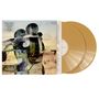 "Snow Patrol Eyes Open 20 Year Anniversary" links. Zwei goldene Schallplatten liegen rechts daneben. Abstrakte Kunst.
