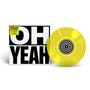 Text: "Yello 'Oh Yeah' 40th Anniversary." Schwarz-weiße Hülle mit großem "OH YEAH"; leuchtend gelbe Schallplatte mit konzentrischen Kreisen.