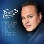 „Frans Bauer“ und „Geluk, Hoop en Liefde“. Ein Mann in einem dunkelblauen Anzug schaut nach vorne.