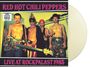 "Red Hot Chili Peppers" oben, "Live at Rockpalast 1985" unten. Vier Männer ohne Hemd, einer hält Gitarre.