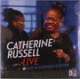Text: "Catherine Russell LIVE @ Jazz at Lincoln Center". Frau mit Mikrofon lächelnd auf einer Bühne. Logo von Dot Time Records.