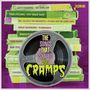 "The Songs That Shaped The Cramps". Stapel grüner Kassetten mit alten Rock'n'Roll-Titeln, Tonbandsymbol.